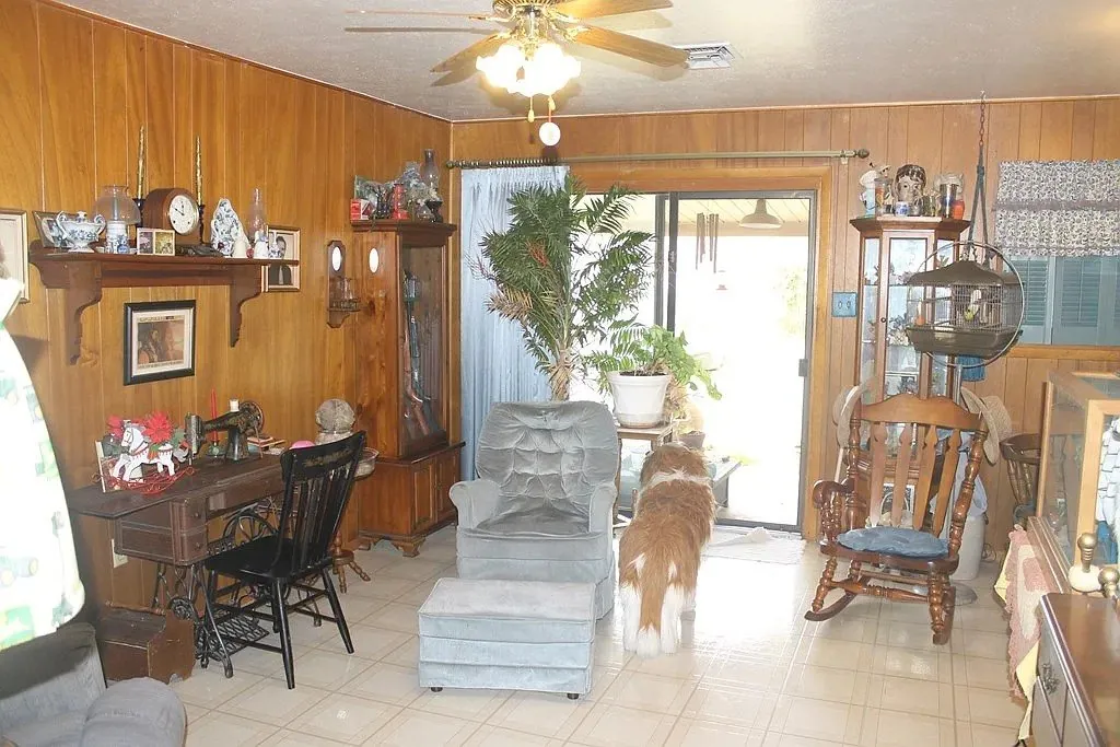 Living room before the remodel, with wood paneling